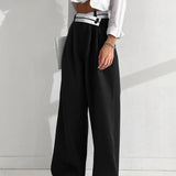 Pantalón ancho con cinturilla asimétrica