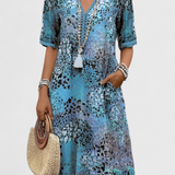 Perla Vestido Boho con Estampado Floral y Detalles en Crochet