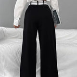 Pantalón ancho con cinturilla asimétrica